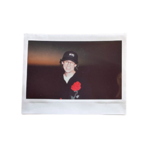 Polaroid photo of the photographer against a glowing sky