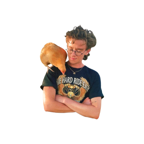 Photo of the photographer with one of his chickens perched on his shoulder