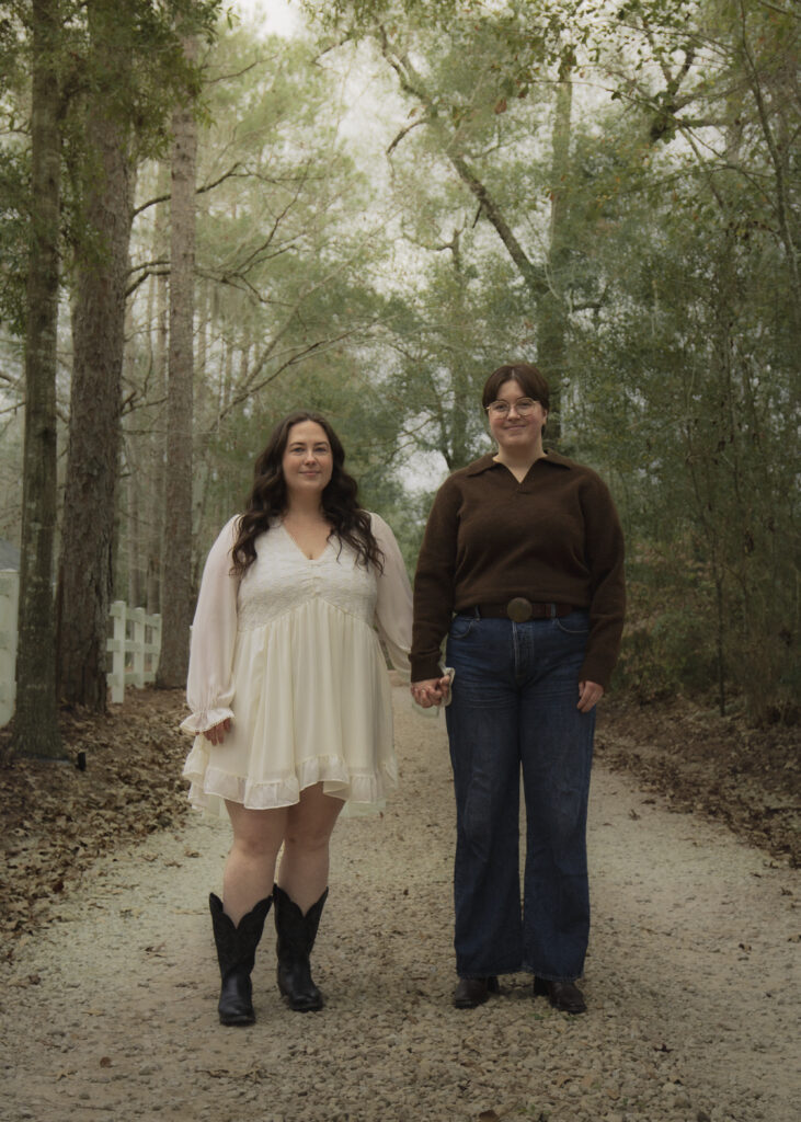 A queer couple stands for a portrait in Thomasville GA
