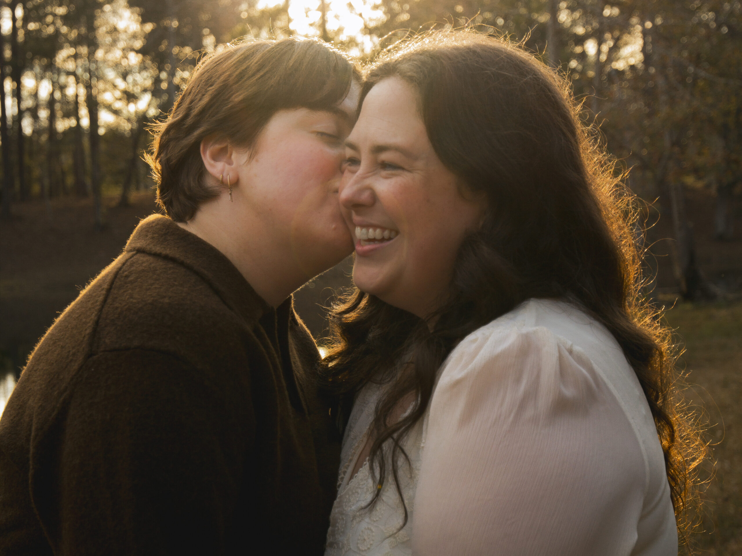A queer couple kisses in hazy, golden light in South GA